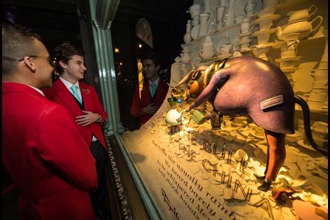 Shoppers enjoy the Fortnum's window depicting the bull and the china.